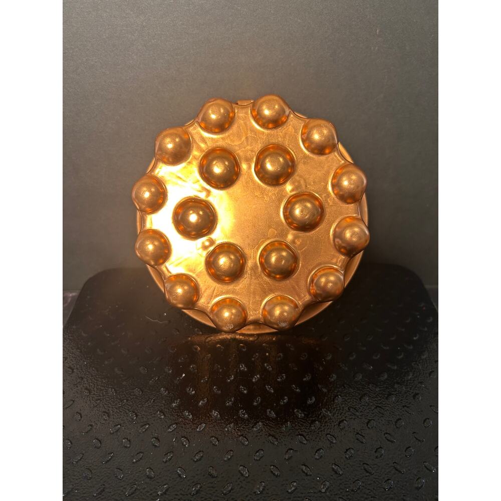 vintage aluminum copper-toned gelatin mold with a scalloped, bubble-top design